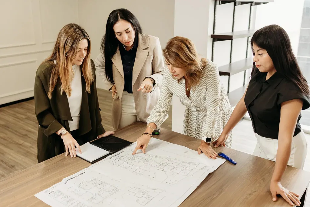 A small group of women explore an idea together