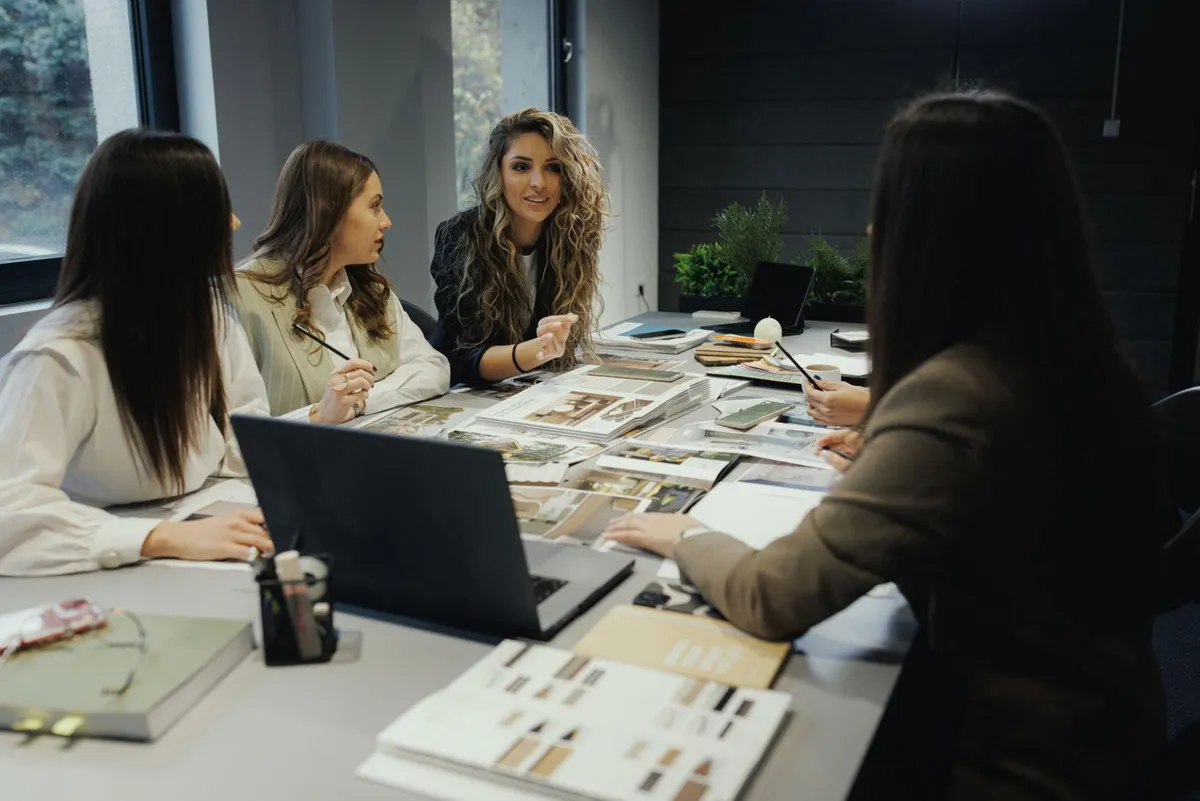 Women sharing ideas around a table